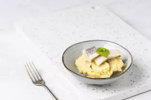 Preistoemp met Vlaamse opgelegde zure haring